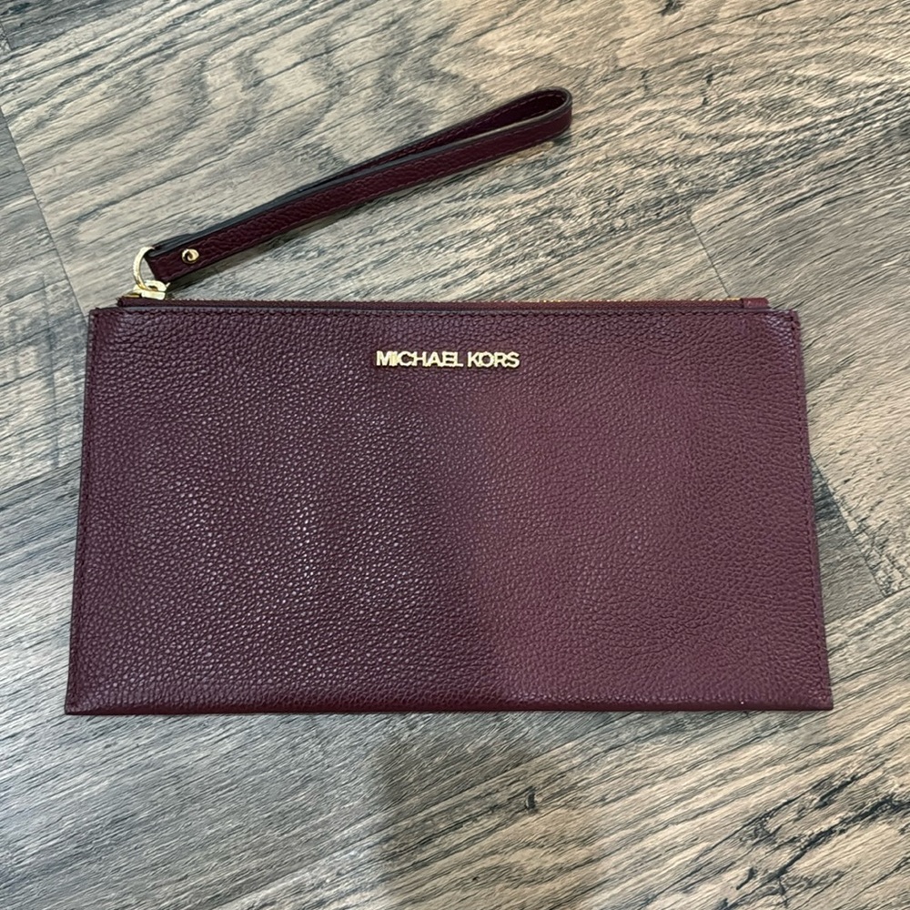 Michael Kors Jet Set Travel Large Perforated Wristlet in Dark Plum Wine